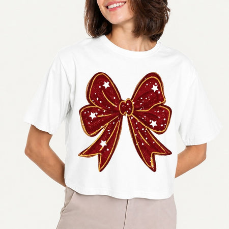 White t-shirt with a large red bow design on a plain background