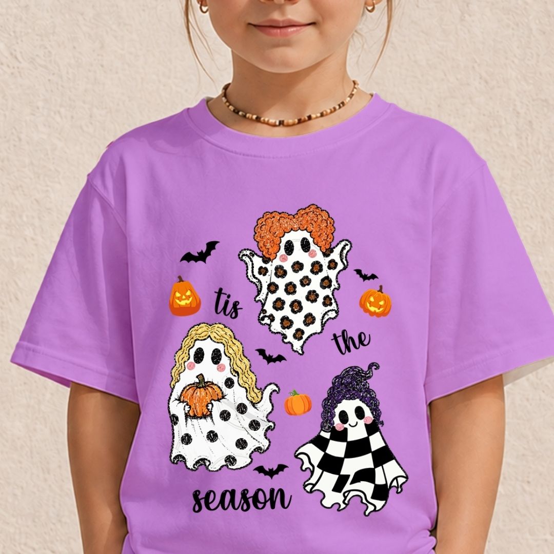 Child wearing a purple t-shirt with a cute Halloween "Tis the Season" ghost sublimation graphic.