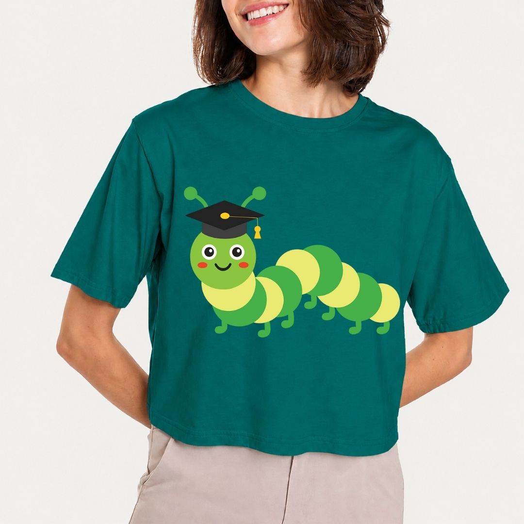 Person wearing a teal t-shirt with a cartoon caterpillar design on a plain background