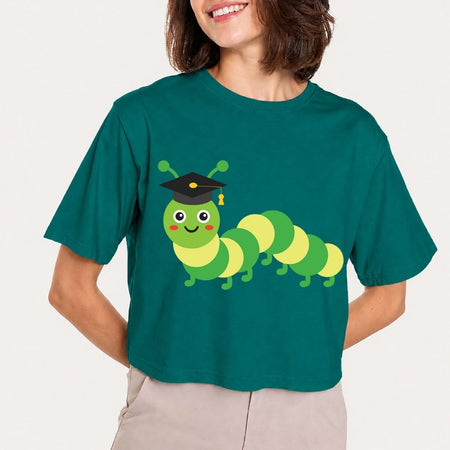 Person wearing a teal t-shirt with a cartoon caterpillar design on a plain background
