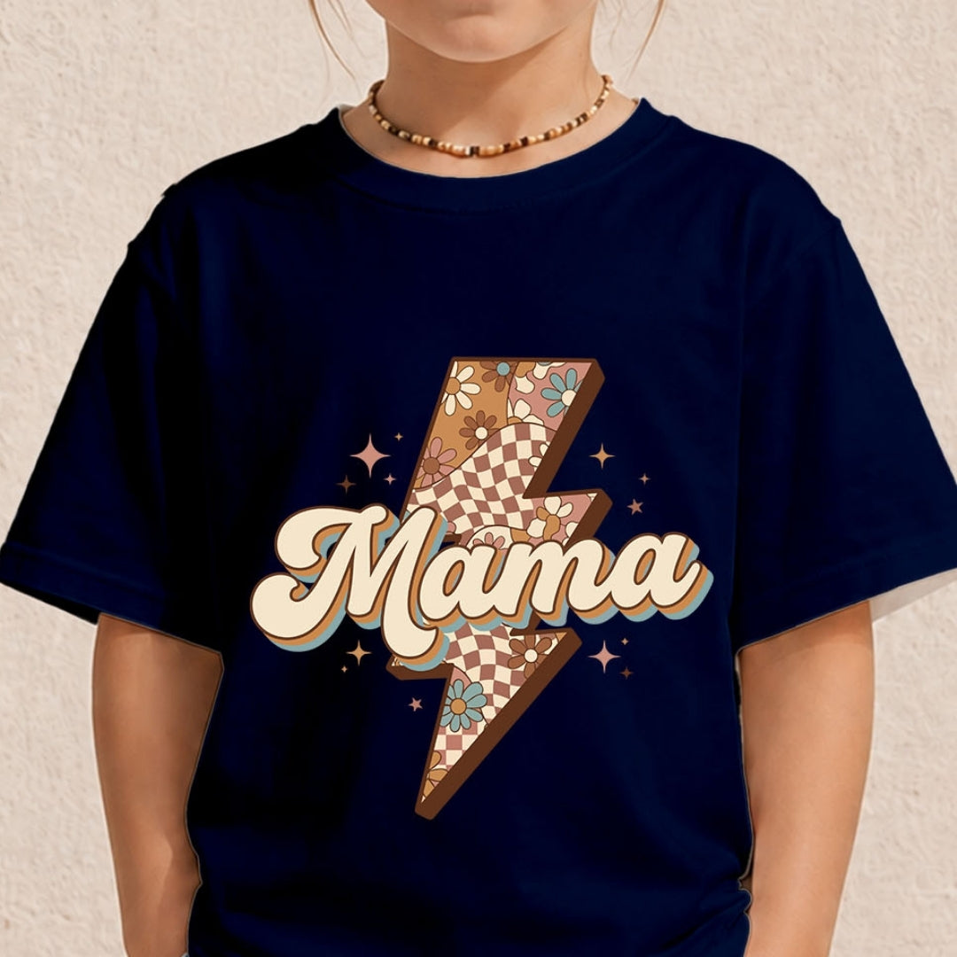 A child wearing a navy blue t-shirt with a graphic design featuring a lightning bolt filled with a checkerboard and floral pattern, and the word 'Mama' in retro cream bubble letters with a blue outline.