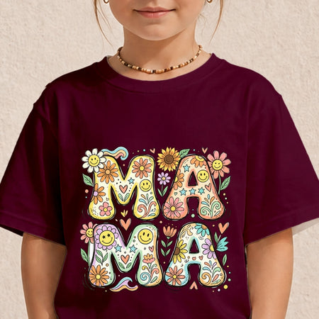 Close-up of a child wearing a dark maroon t-shirt printed with a colorful vintage psychedelic "MAMA" floral typography design.