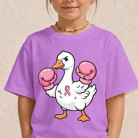 A child wearing a purple short-sleeve t-shirt with a cartoon graphic of a white duck wearing pink boxing gloves and a pink ribbon on its chest, set against a textured beige wall.