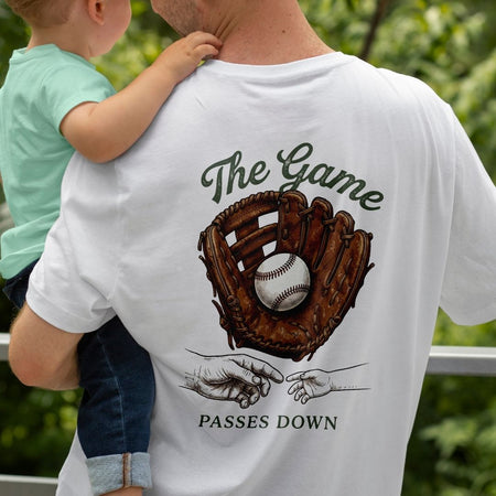 Father Holding Toddler wearing White Graphic Baseball T-Shirt