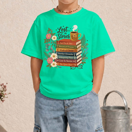 Person wearing a green t-shirt with a book-themed design on a beige background