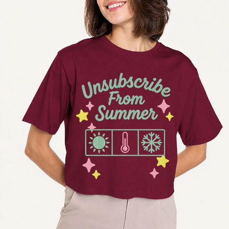 Person wearing a maroon t-shirt with 'Unsubscribe From Summer' text and graphics on a plain background