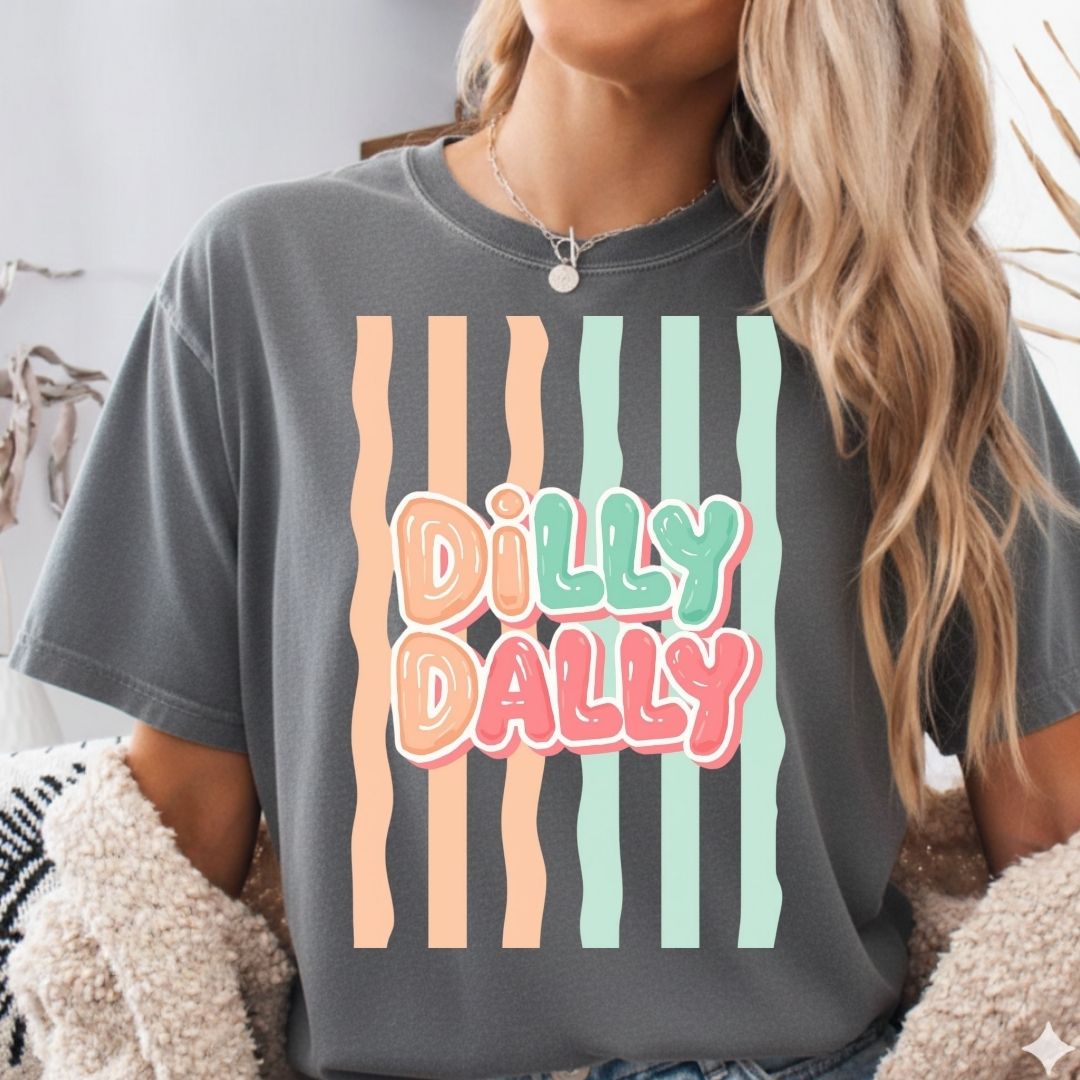 Person wearing a gray t-shirt with 'Dilly Dally' graphic design.