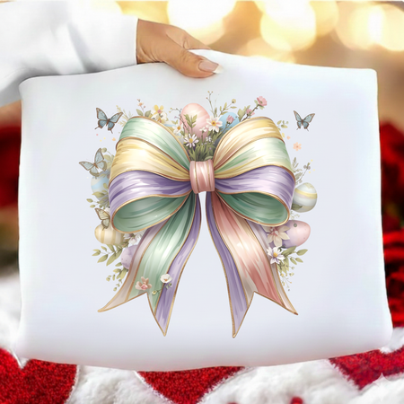 White pillow with a colorful bow design on a blurred festive background