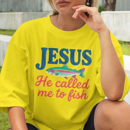 Person wearing a yellow t-shirt with 'Jesus He called me to fish' text and fish graphic.
