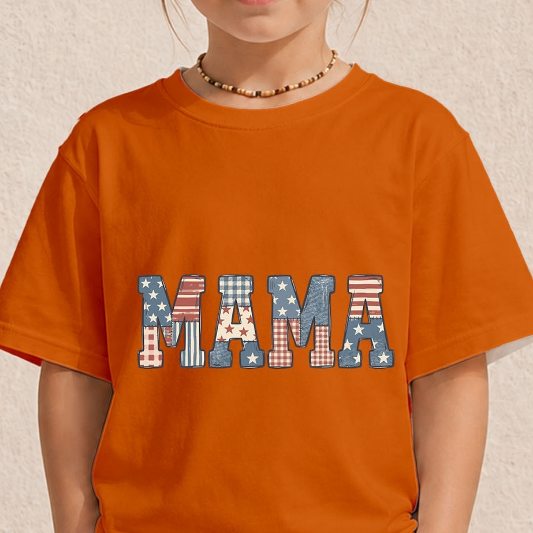 Close-up of a child wearing a bright orange crewneck t-shirt printed with a rustic patriotic "MAMA" text design featuring American flag pattern fillings.