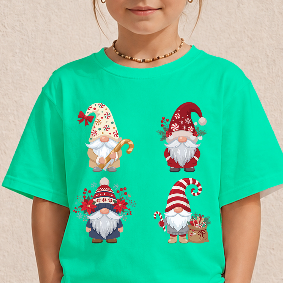 Child wearing a bright turquoise t-shirt featuring a festive Christmas gnomes graphic with holiday characters.