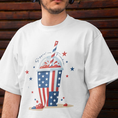 Close up of a man wearing a casual white t-shirt displaying the red, white, and blue American flag drink cup graphic on the front