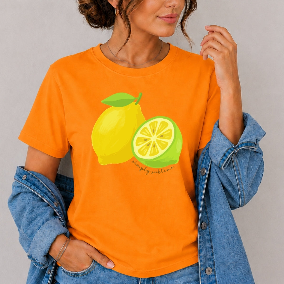 Person wearing an orange t-shirt with lemon graphics and text, standing against a plain background.