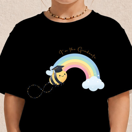 A person wearing a black short-sleeve T-shirt with a colorful cartoon bee and rainbow graphic on the front, plus the text 'I'm the Graduate.' The photo is cropped from the neck to the torso against a light neutral background.