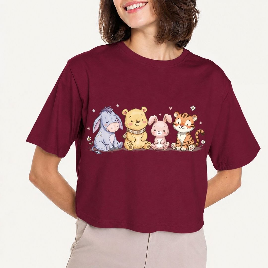 Person wearing a maroon t-shirt with cartoon characters on a plain background