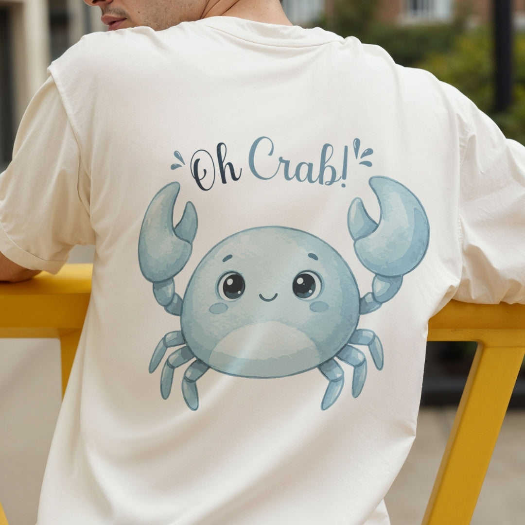 A person seen from the back wearing a white t-shirt featuring a blue cartoon crab graphic and the text "Oh Crab!"