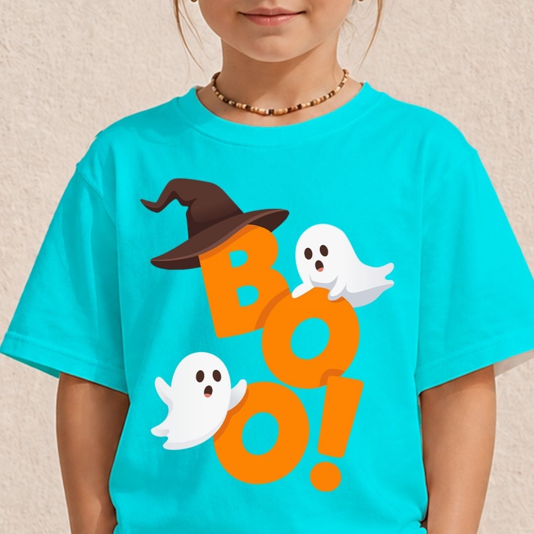 Child wearing a bright turquoise t-shirt with a spooky orange "BOO!" ghost and witch hat sublimation graphic.
