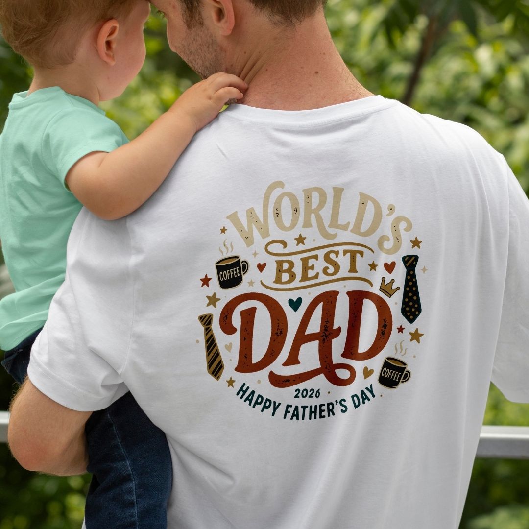 Man wearing a 'World's Best Dad' t-shirt with a child on his shoulders, outdoors.