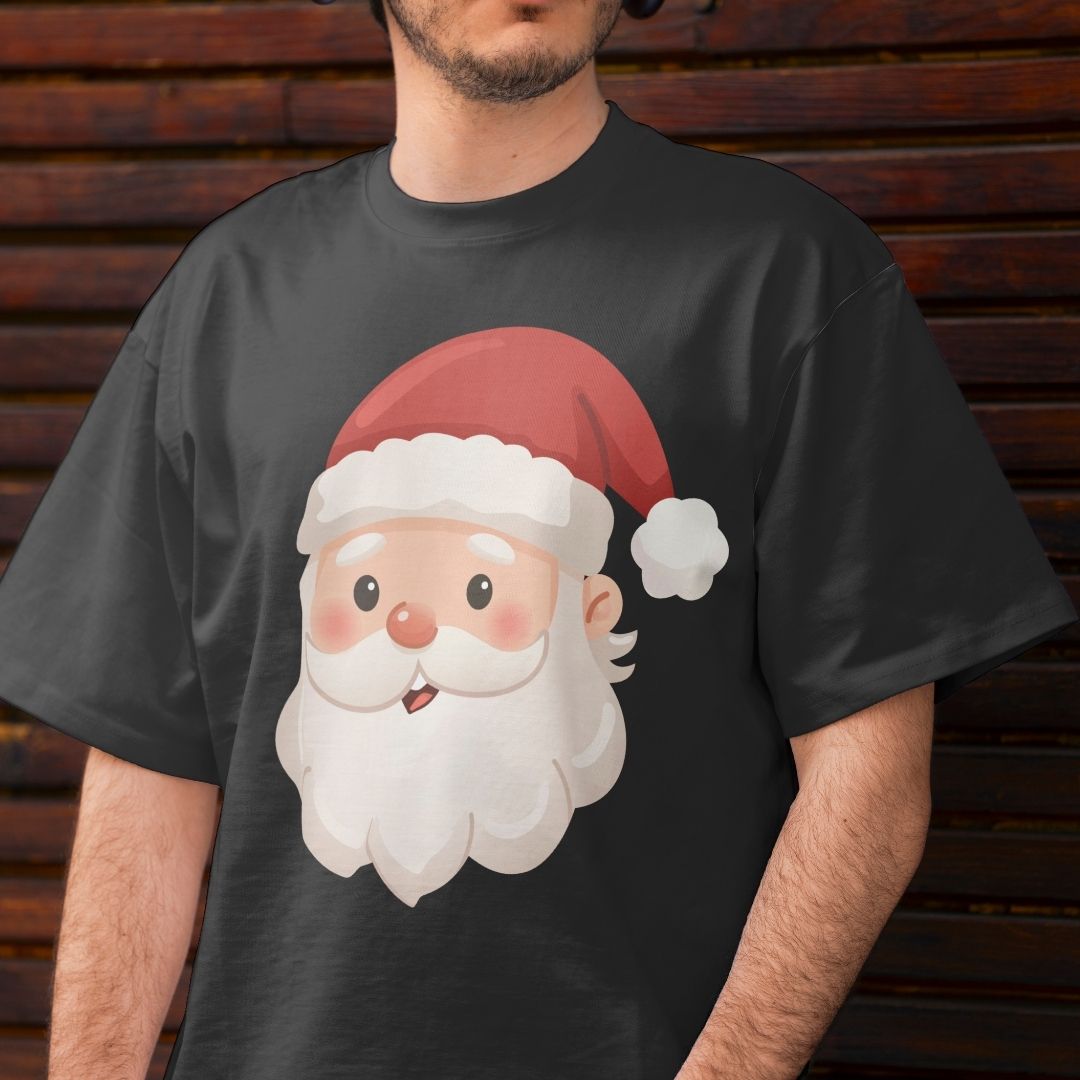 A man wearing a dark charcoal gray t-shirt with a cartoon graphic of Santa Claus's face on the front, standing against a dark wooden plank background.