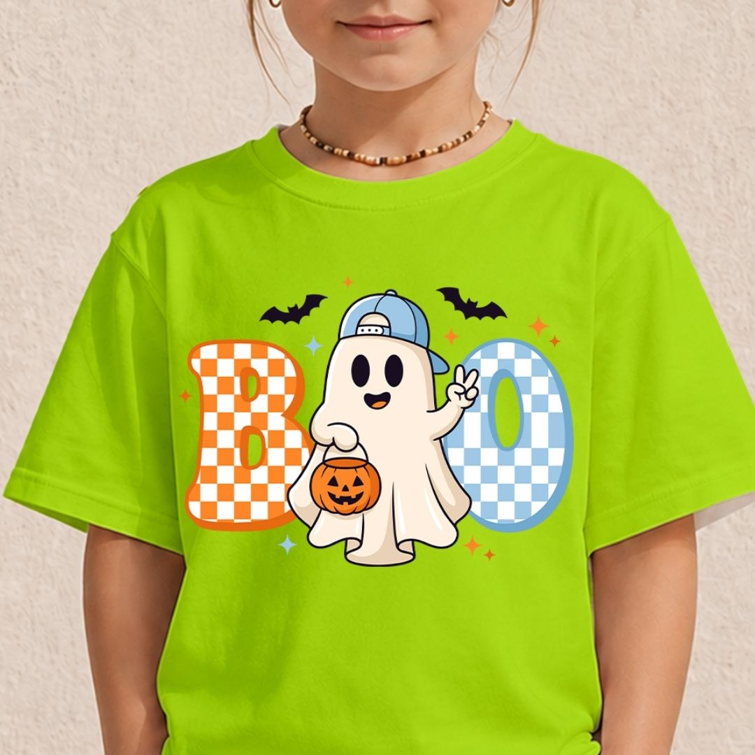 Child wearing a lime green t-shirt showcasing a playful Halloween ghost graphic with checkered "BOO" lettering.