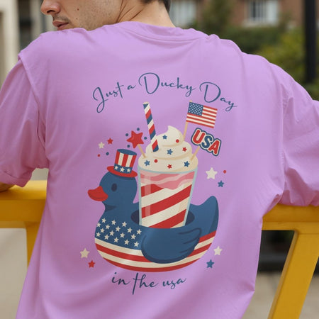 Close up of a man wearing a casual white t-shirt displaying the red, white, and blue American flag drink cup graphic on the front.