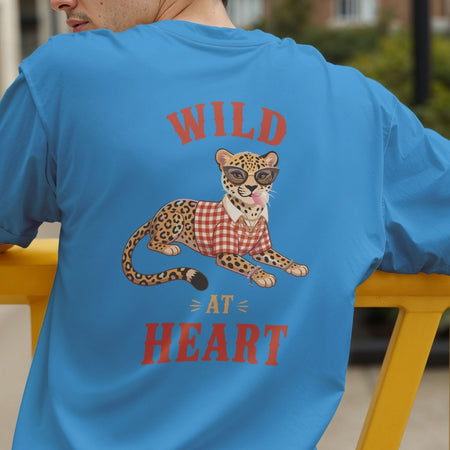 Back view of a person wearing a bright blue t-shirt showcasing the stylish "Wild At Heart" leopard graphic.
