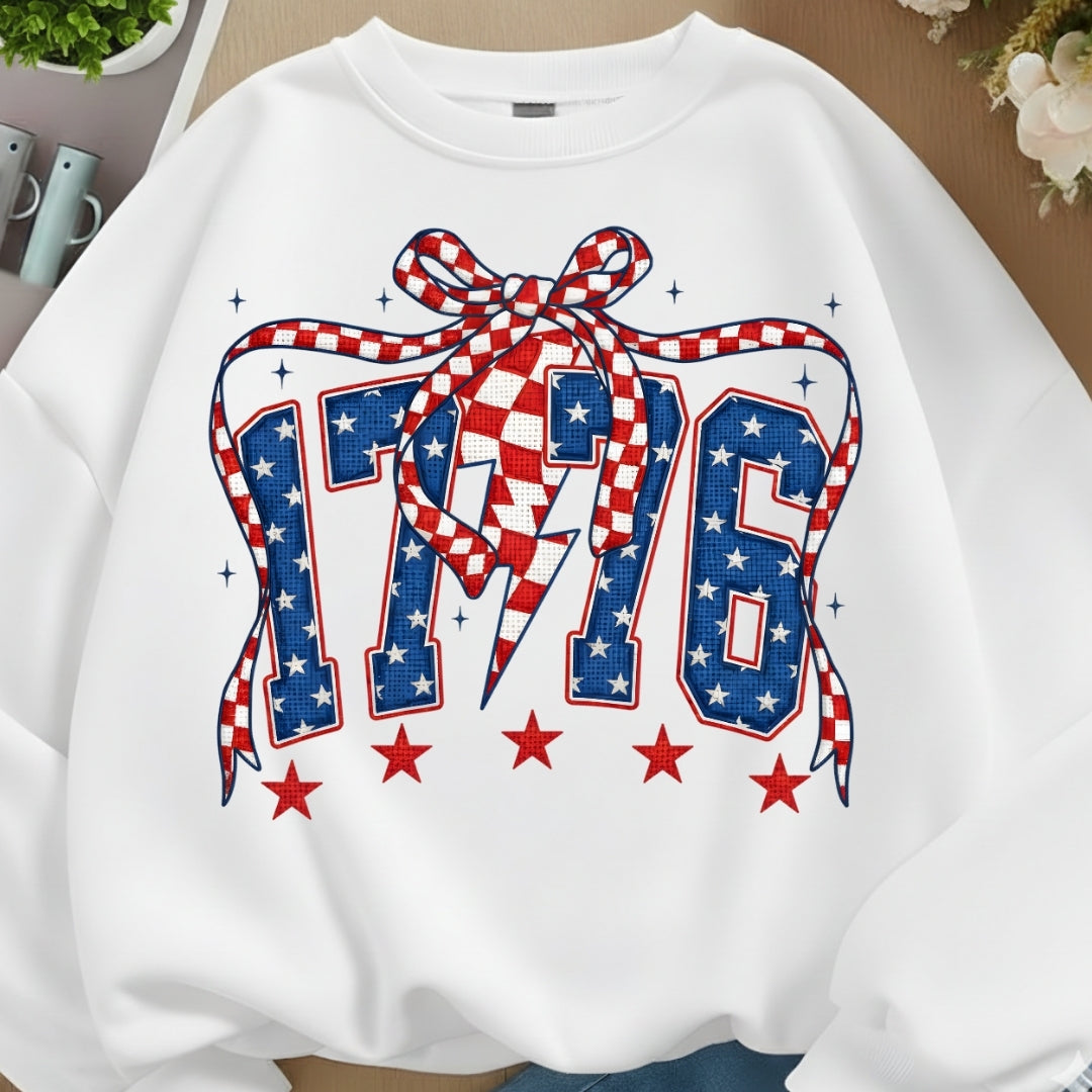 White sweatshirt with a red, white, and blue design featuring stars and a bow.