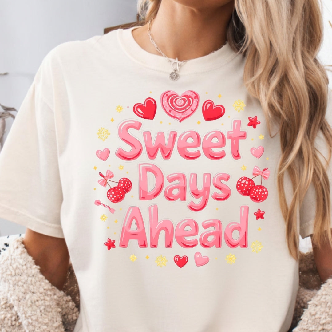 Person wearing a white t-shirt with 'Sweet Days Ahead' text and graphics.