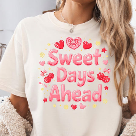 Person wearing a white t-shirt with 'Sweet Days Ahead' text and graphics.