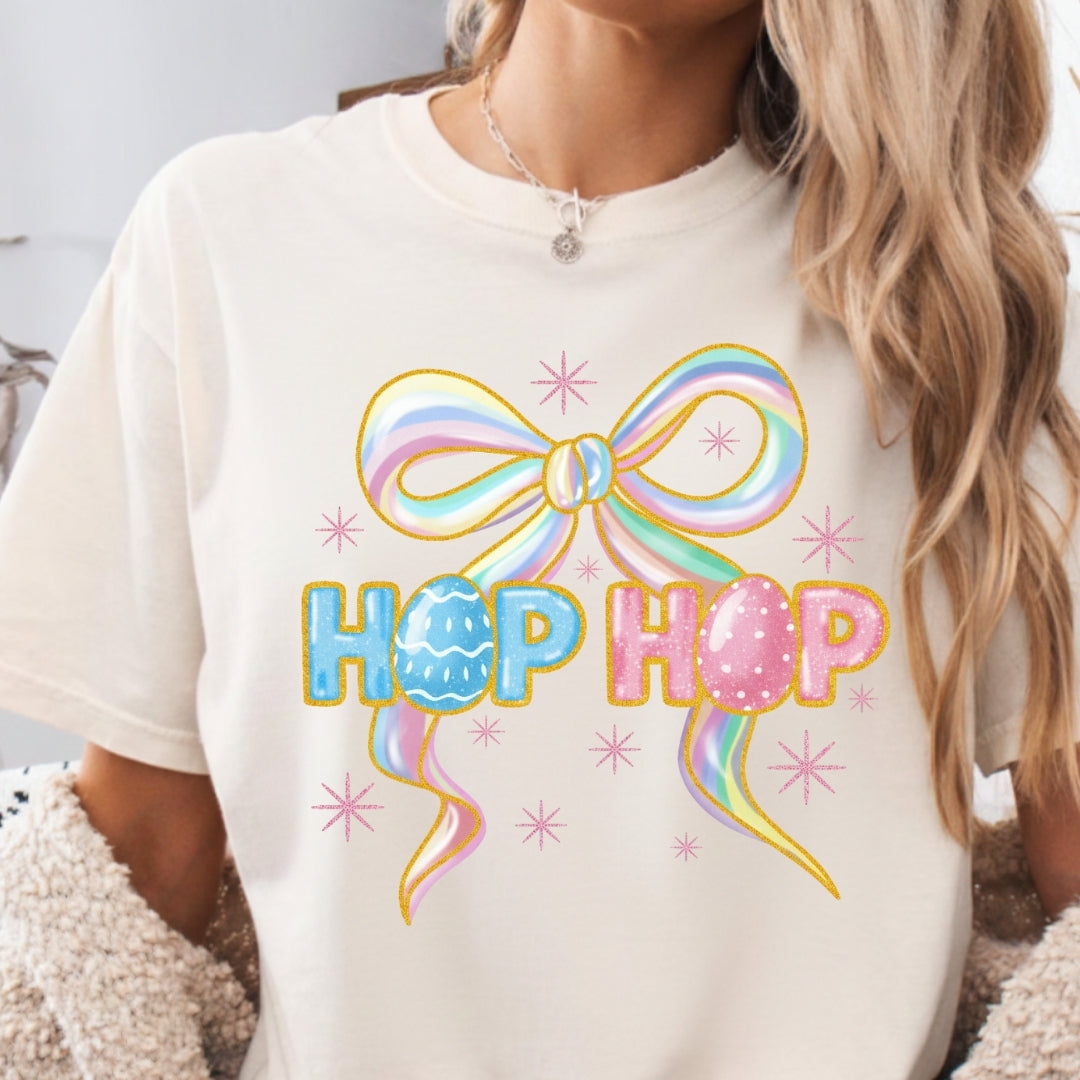 White t-shirt with colorful bow and 'Hop Hop' text design.