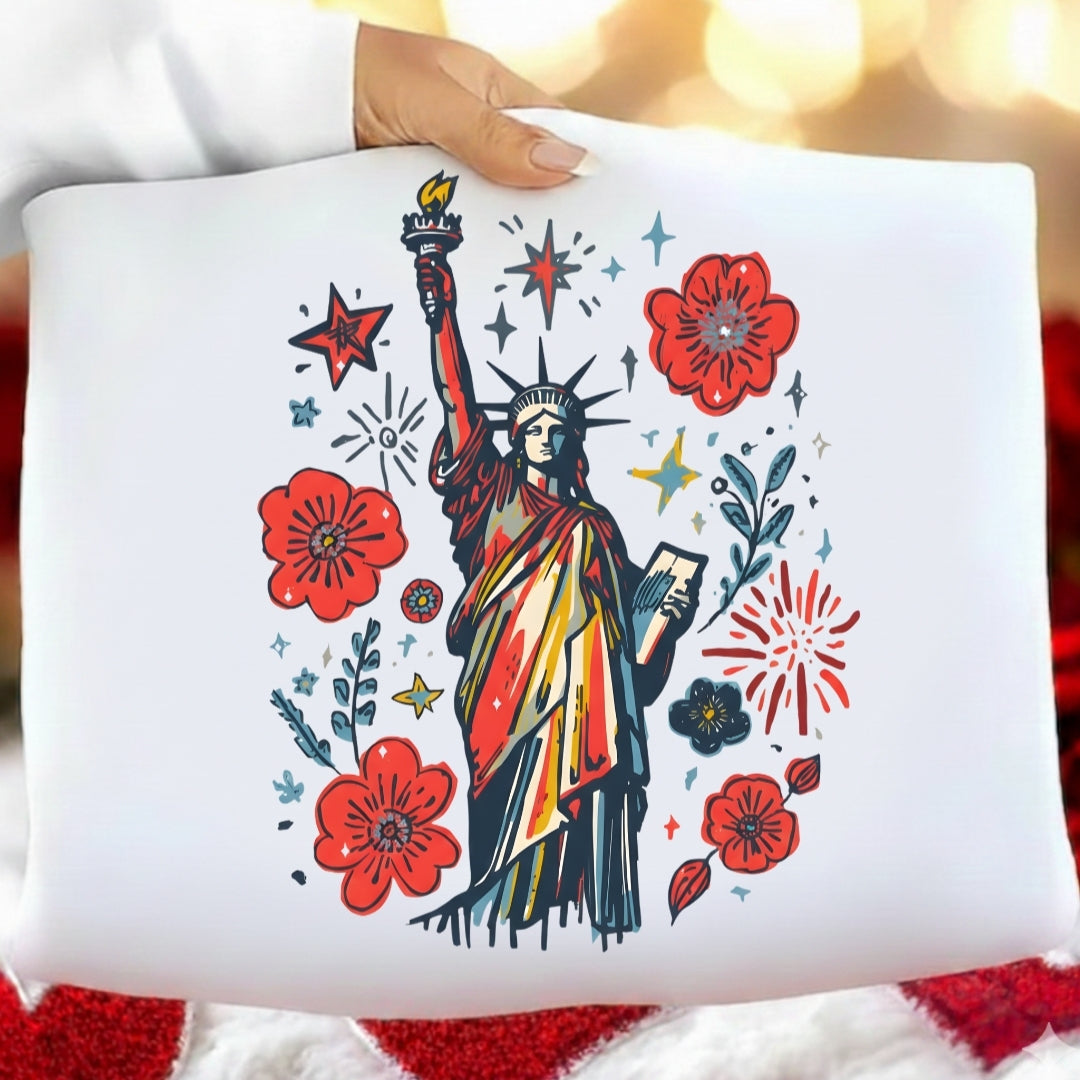 White pillow with Statue of Liberty and floral design on a blurred background