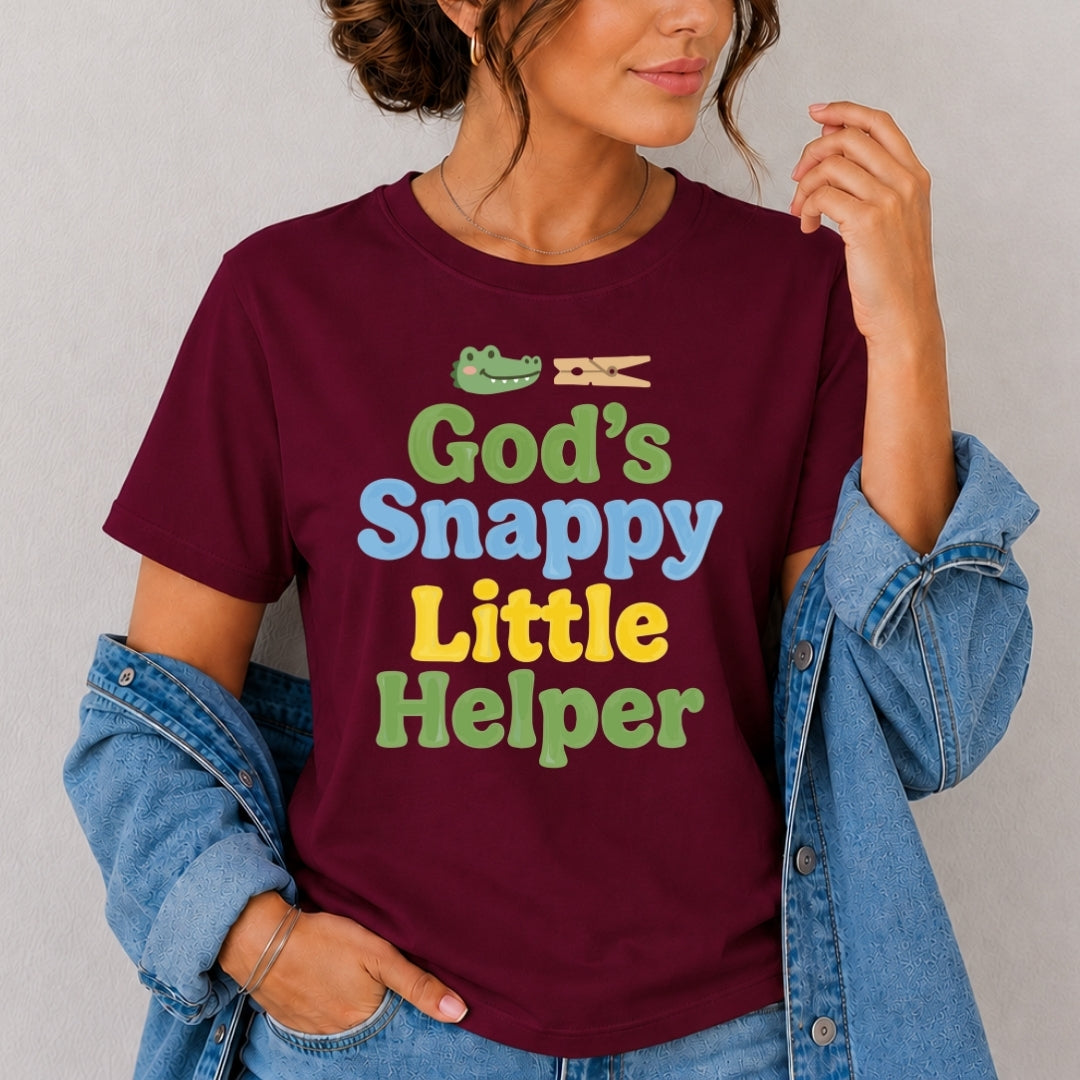 Person wearing a maroon t-shirt with colorful text and graphics on a plain background