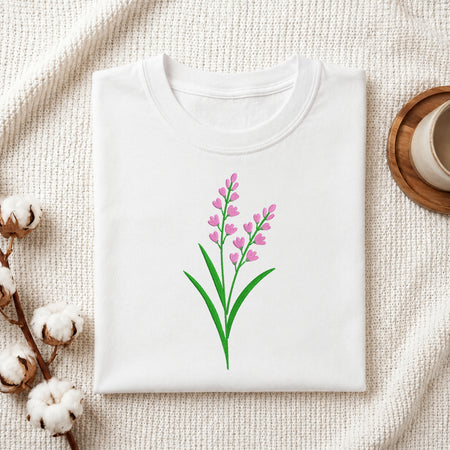 Folded white t-shirt featuring a pink lavender floral embroidery design centered on the chest.