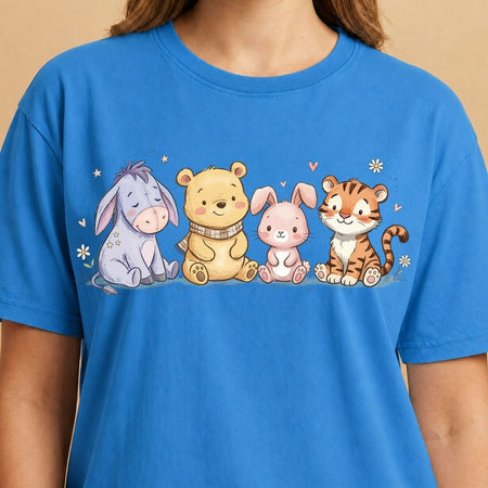Blue t-shirt with cartoon characters on a beige background