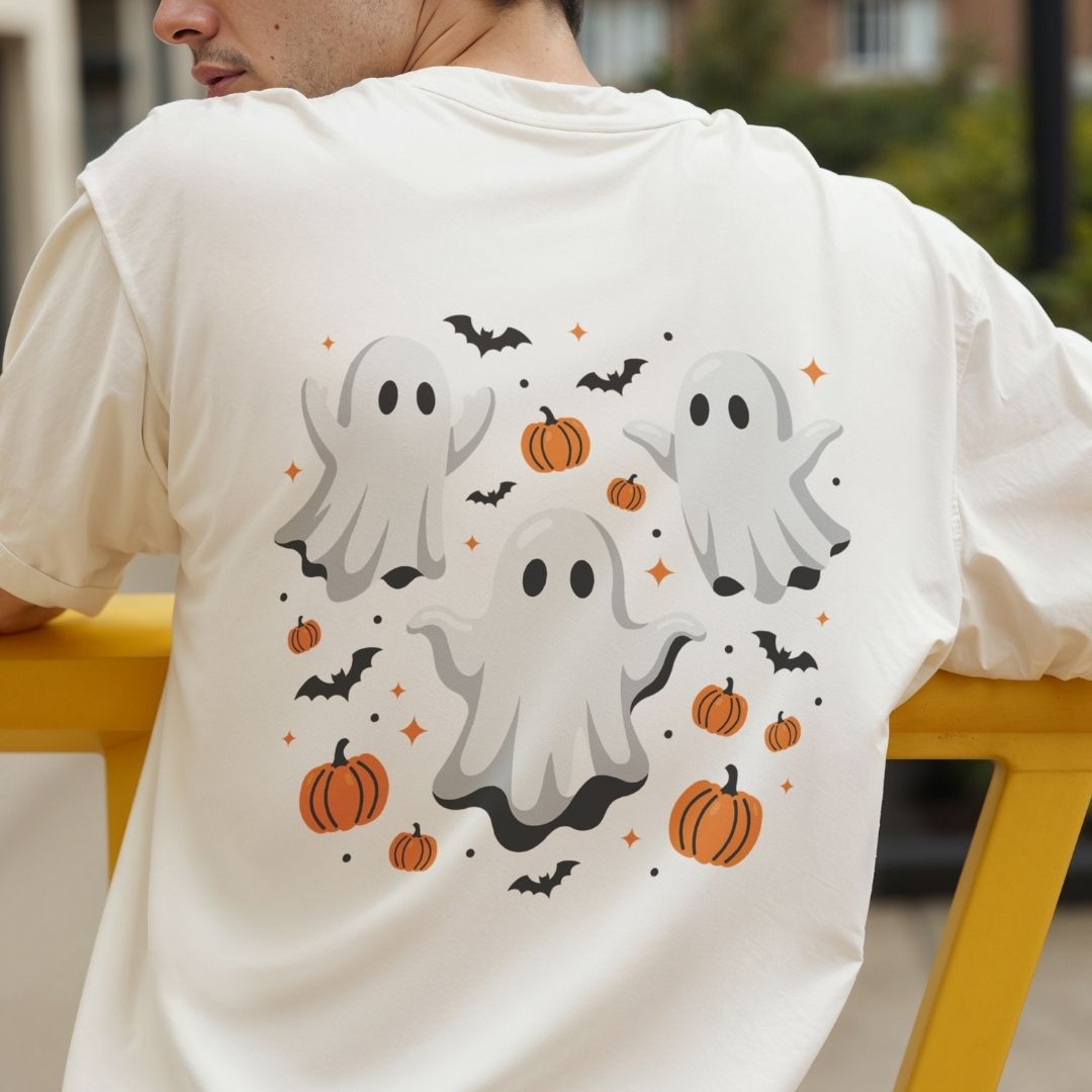 Child wearing a purple t-shirt showcasing a playful three-ghosts and pumpkins Halloween design.