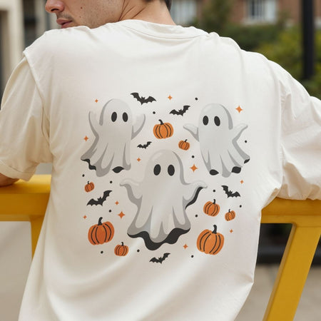 Child wearing a purple t-shirt showcasing a playful three-ghosts and pumpkins Halloween design.