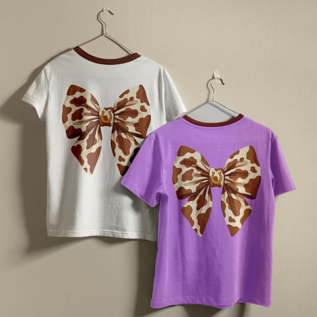 Western Cow Print Bow Ringer Shirts on Hangers