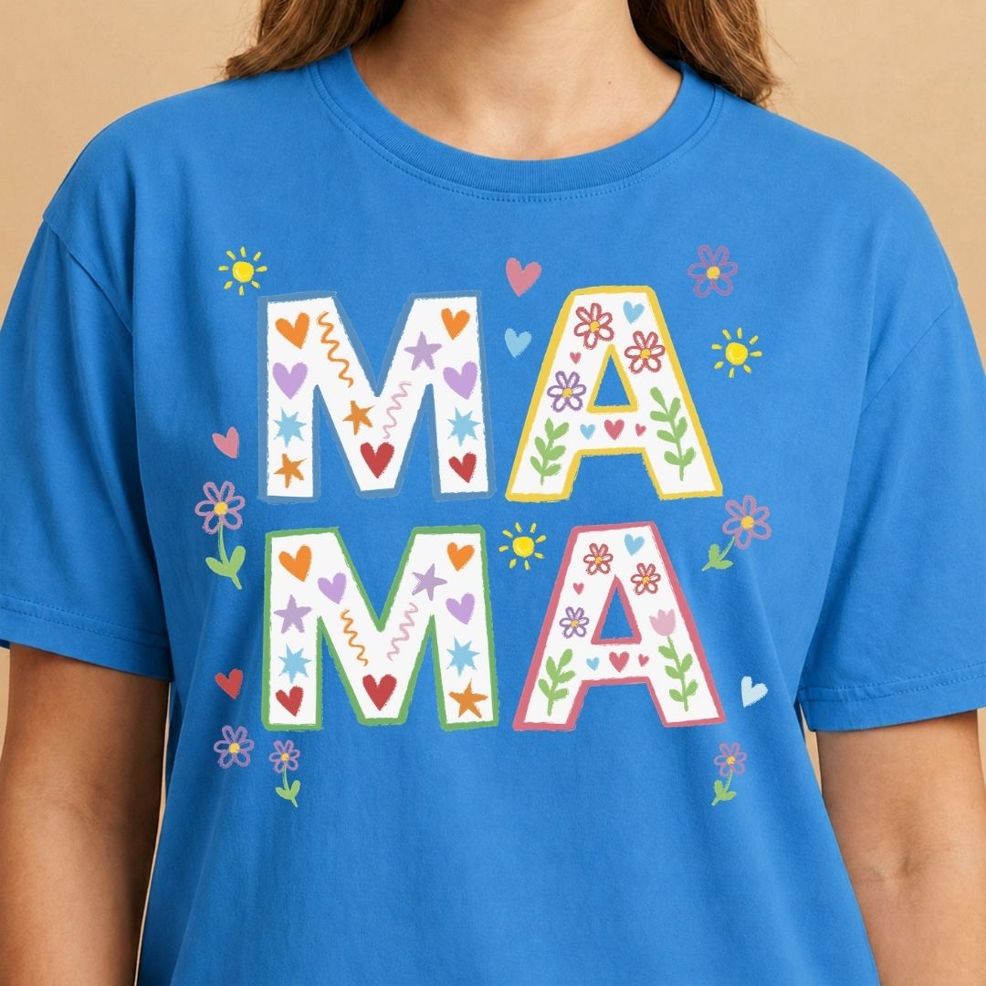 Blue t-shirt with colorful 'MAMA' text on a beige background