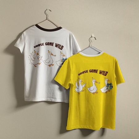 White and yellow t-shirts hanging on a wall, both displaying the humorous "GOOSE GONE WILD" partying geese graphic printed on the back.