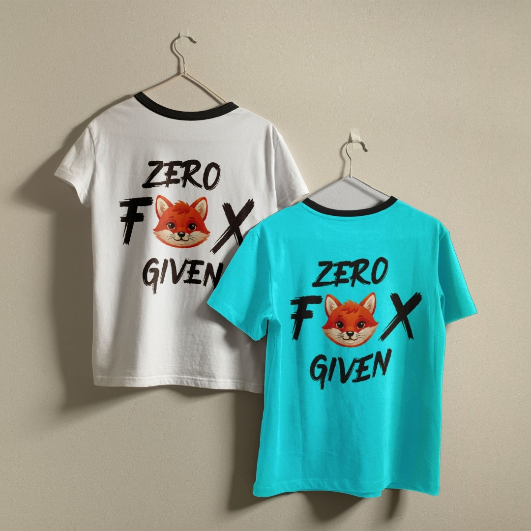 Two crewneck t-shirts, one white and one bright cyan blue, hanging on a wall showing the funny cartoon fox Zero Fox Given design.