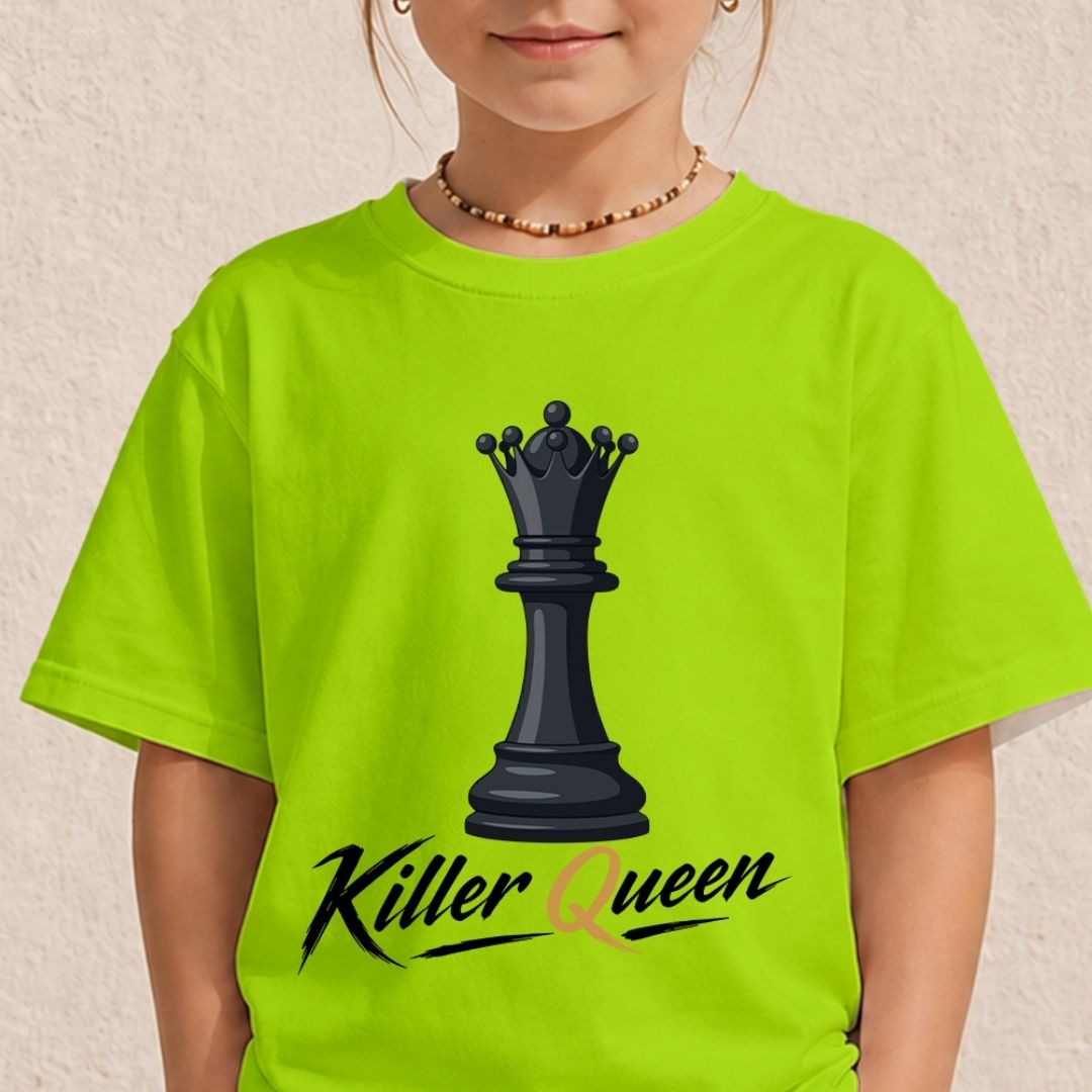 A child wearing a bright neon yellow-green t-shirt with a black chess queen graphic and the words 'Killer Queen' printed on the front, set against a textured beige wall.