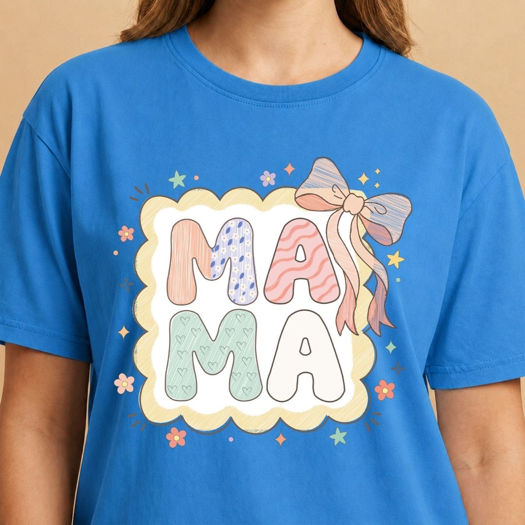 Blue t-shirt with 'MAMA' text and decorative elements on a beige background
