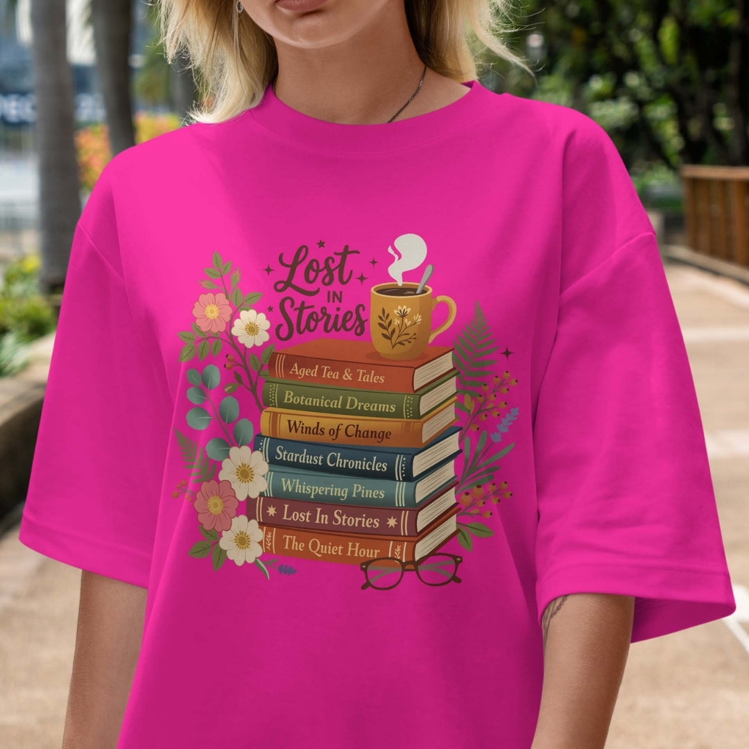 Person wearing a pink t-shirt with 'Lost in Stories' book-themed design.