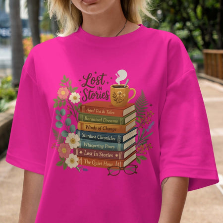 Person wearing a pink t-shirt with 'Lost in Stories' book-themed design.