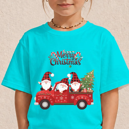 A child wearing a bright turquoise short-sleeve T-shirt with a festive Christmas graphic. The graphic features the text 'Merry Christmas' above three Santa Claus figures sitting in a red pickup truck carrying a decorated Christmas tree.