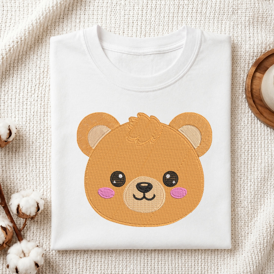 White t-shirt with a bear face design on a textured beige surface.