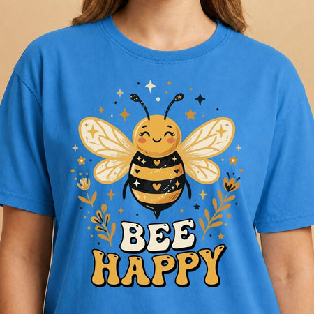 Blue t-shirt with a bee design and 'Bee Happy' text on a beige background