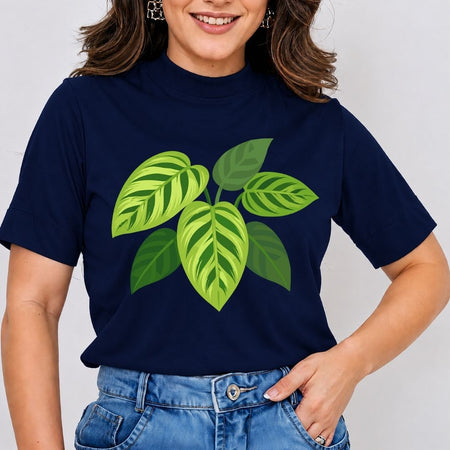 A woman wearing a navy blue short-sleeve t-shirt with a green leaf graphic on the front, paired with blue jeans, against a plain light gray background.
