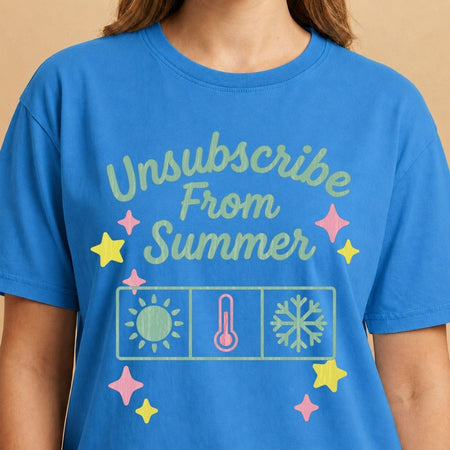 Blue t-shirt with 'Unsubscribe From Summer' text and graphics on a beige background