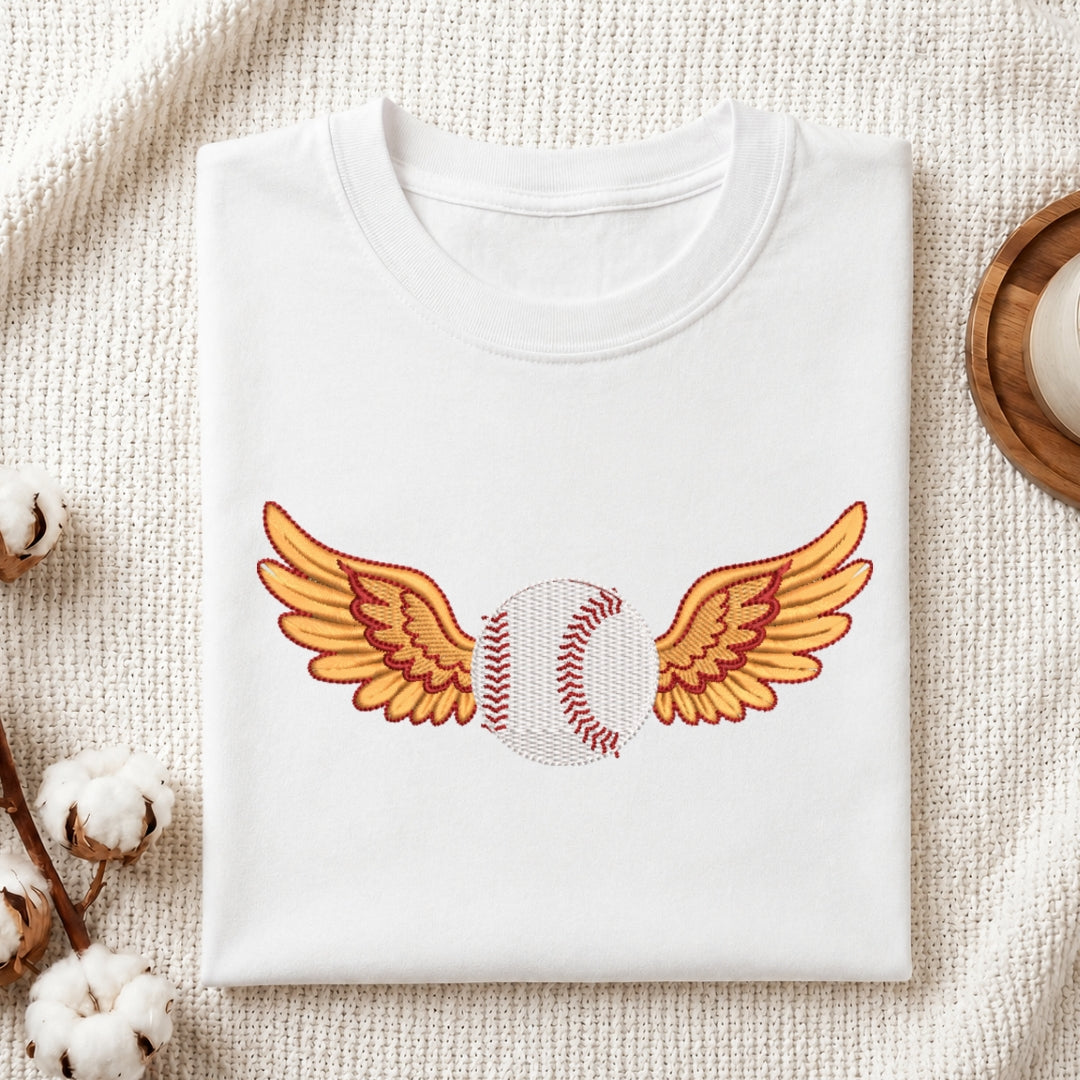 White sweatshirt with a baseball and wings design on a textured surface.